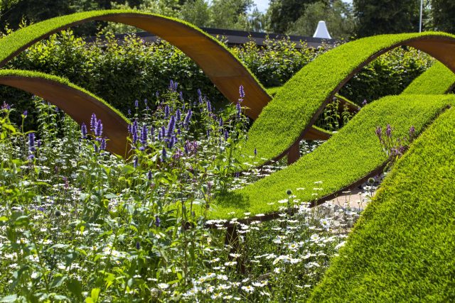 The World Vision Garden, Gold Medal Winning garden at RHS Hampton Court Palace Flower Show, The design of the garden is a horticultural interpretation London.