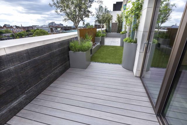 Roof Terrace Design St John's Wood London, by The Garden Buidlers artificial grass, artificial decking and cladding, roof garden to created sunset silhouettes.