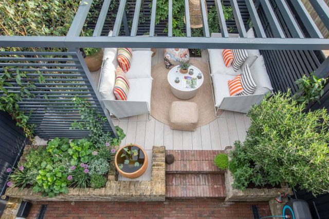 Greenwich Charlton Garden Design by The Garden Builders, outdoor lighting, Pergola structure, roof terrace building company in London top rated, Garden Room.