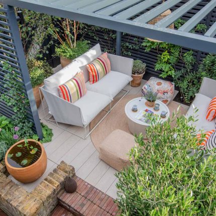 Greenwich Charlton Garden Design by The Garden Builders, outdoor lighting, Pergola structure, roof terrace building company in London top rated, Garden Room.