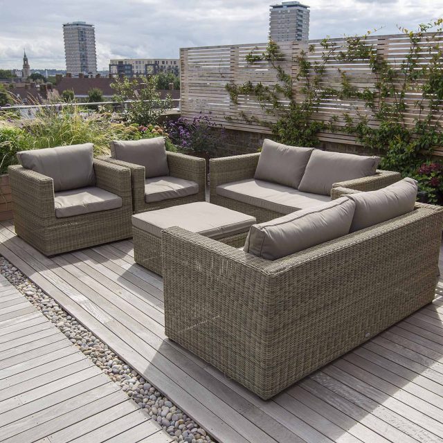 Roof terrace with decking, artificial level lawn and LED lighting design at New Concordia Wharf, highlight surfaces and architectural elements in the evenings.