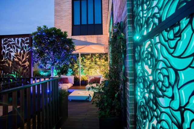 Roof terrace design Covent Garden composite decking luxurious entertaining in the heart of London with contemporary furniture a bio-fuel burning fire table.