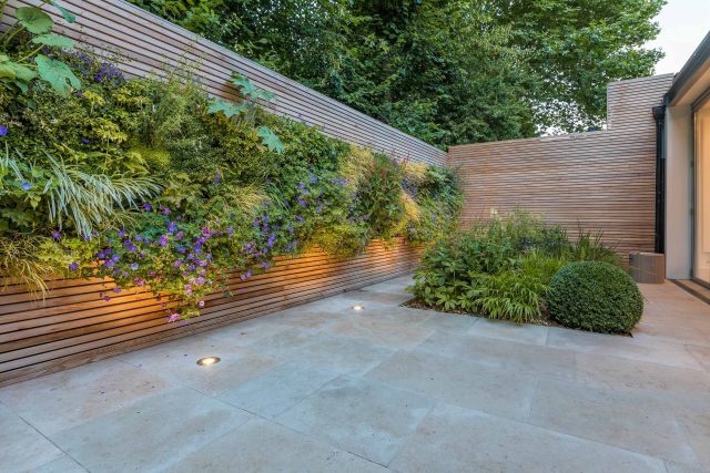 Hardscaping design structure and contrast elements to the organic forms, and likewise provides continuity between the indoor and outdoor areas of the property.