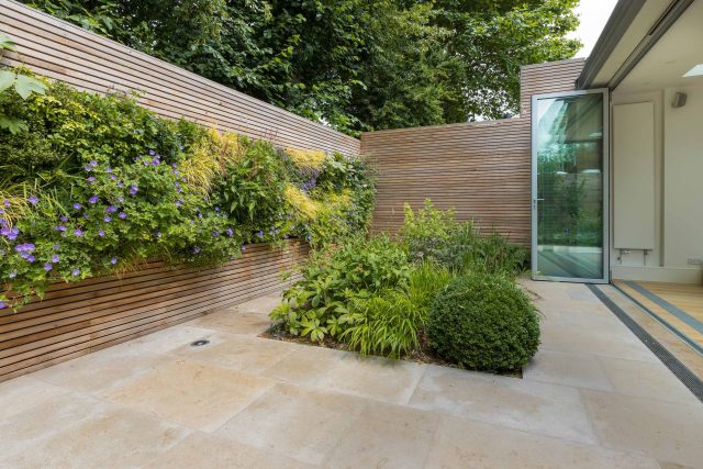 Hardscaping design structure and contrast elements to the organic forms, and likewise provides continuity between the indoor and outdoor areas of the property.