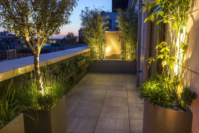 Roof Terrace Design St John's Wood London, by The Garden Buidlers artificial grass, artificial decking and cladding, roof garden to created sunset silhouettes.