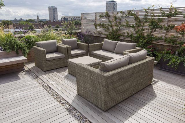 Roof terrace with decking, artificial level lawn and LED lighting design at New Concordia Wharf, highlight surfaces and architectural elements in the evenings.