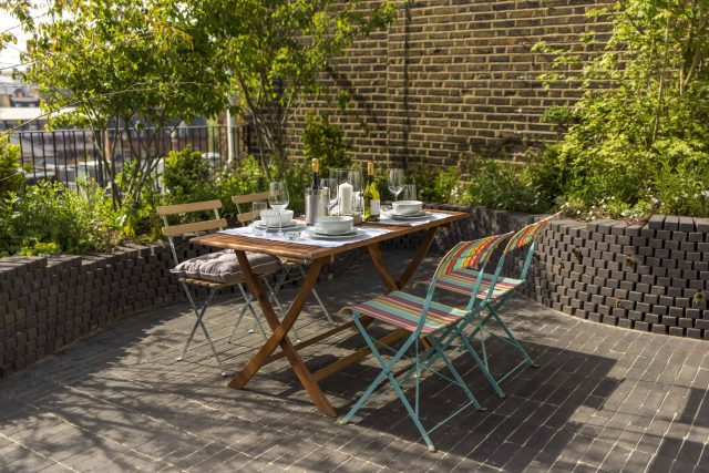 Marylebone London garden design by Todd Longstaff-Gowan and built by The Garden Buidlers brick patio drainage landscaping, planting with shrubs and climbers.
