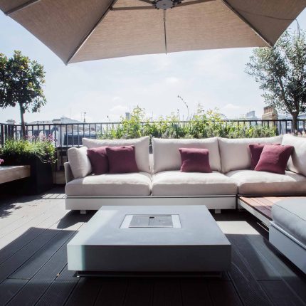 Roof terrace design Covent Garden composite decking luxurious entertaining in the heart of London with contemporary furniture a bio-fuel burning fire table.