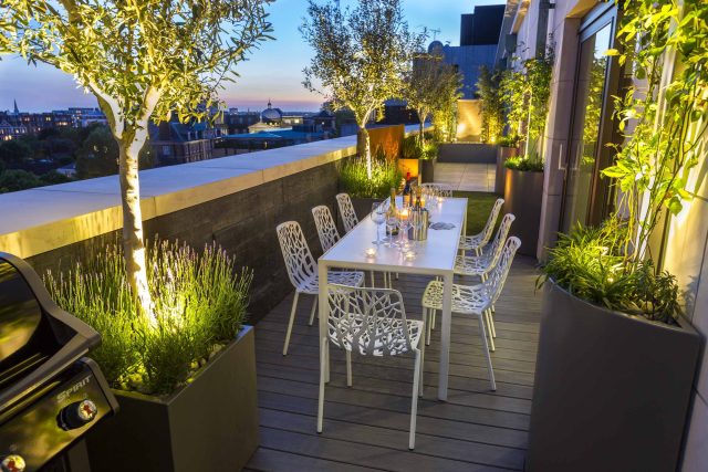 Roof Terrace Design St John's Wood London, by The Garden Buidlers artificial grass, artificial decking and cladding, roof garden to created sunset silhouettes.