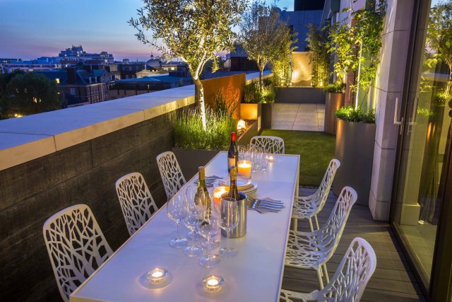 Roof Terrace Design St John's Wood London, by The Garden Buidlers artificial grass, artificial decking and cladding, roof garden to created sunset silhouettes.