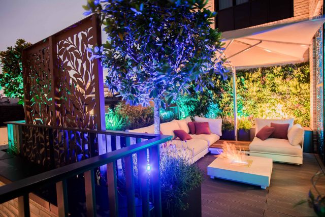Roof terrace design Covent Garden composite decking luxurious entertaining in the heart of London with contemporary furniture a bio-fuel burning fire table.