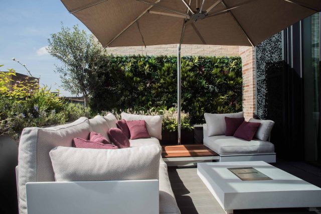 Roof terrace design Covent Garden composite decking luxurious entertaining in the heart of London with contemporary furniture a bio-fuel burning fire table.