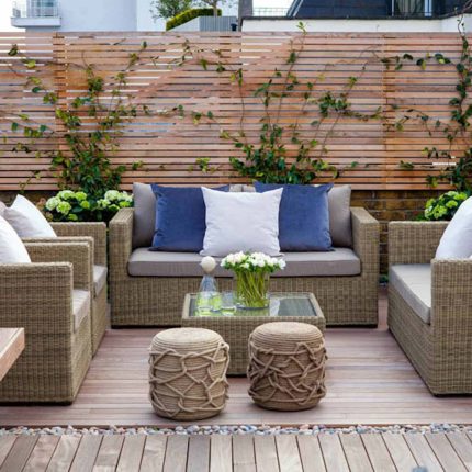 Roof terrace with decking, artificial level lawn and LED lighting design at New Concordia Wharf, highlight surfaces and architectural elements in the evenings.