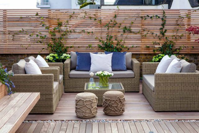 Roof terrace with decking, artificial level lawn and LED lighting design at New Concordia Wharf, highlight surfaces and architectural elements in the evenings.