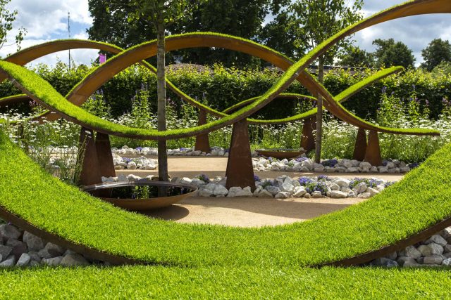 The World Vision Garden, Gold Medal Winning garden at RHS Hampton Court Palace Flower Show, The design of the garden is a horticultural interpretation London.