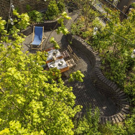 Marylebone London garden design by Todd Longstaff-Gowan and built by The Garden Buidlers brick patio drainage landscaping, planting with shrubs and climbers.