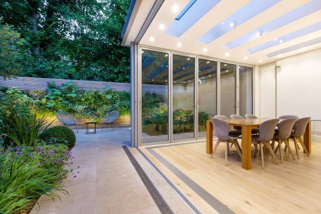 Hardscaping design structure and contrast elements to the organic forms, and likewise provides continuity between the indoor and outdoor areas of the property.