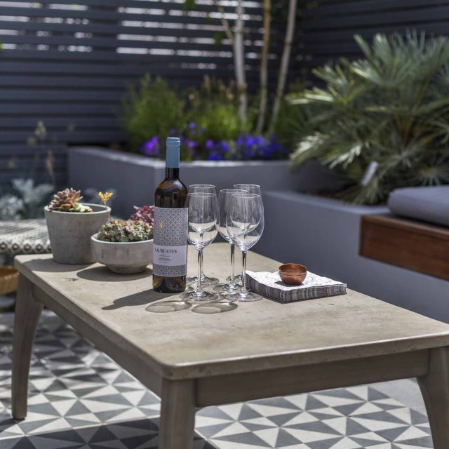 Private Small Garden Design for small south London courtyard garden evolved from client's love for handmade Italian tiles outdoor room ideas.