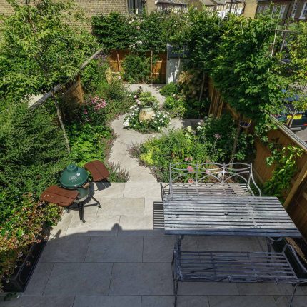 Small garden design in Clapham south London, carefully edited elements can create a perfect garden composition in a small space, planting vibrant luxuriously.