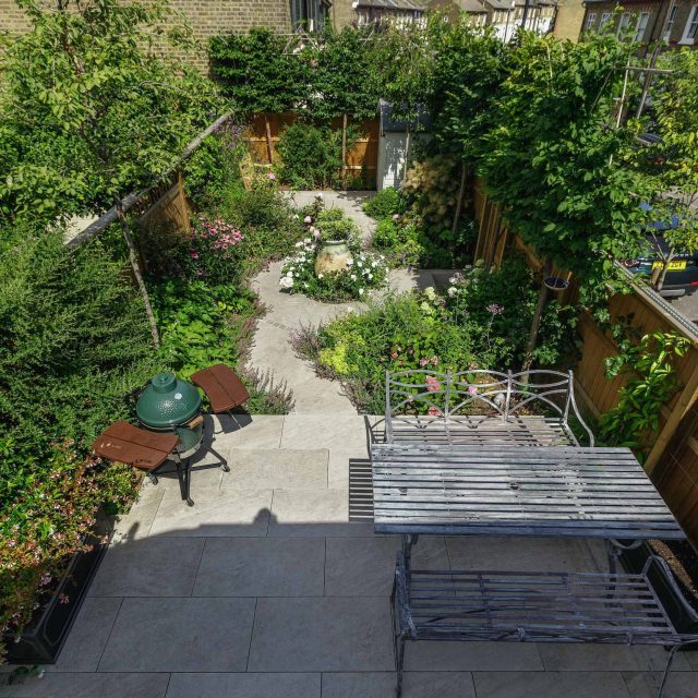 Small garden design in Clapham south London, carefully edited elements can create a perfect garden composition in a small space, planting vibrant luxuriously.