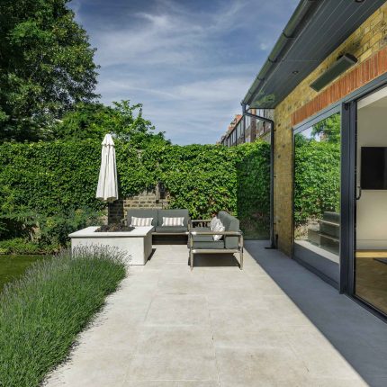 Elegant Family Garden design Tooting Bec contemporary style family friendly garden with kids play area, includes a variety of shrub and architectural planting.