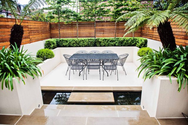 Beautiful London Garden, Clancarty Road, London, new block rendered boundary walls, planting, lighting, submersible water lights, bright contemporary effect.