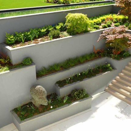 Contemporary garden Kingston Surrey, designed to exuding modern glamour with entertaining and activity space, geometric striking lines, architectural space.