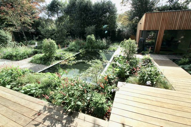 Garden Design Golders Green Strict, linear geometry gives way to a gently curving, hoggin path around the house vibrant relaxing space designed by Lynne Marcus.