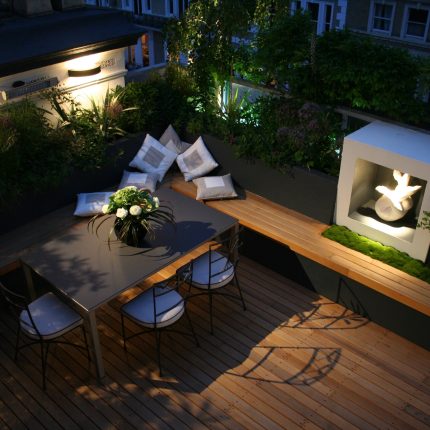 Kensington Roof Garden Terrace roof top designer by Andy Sturgeon combines timber and mixed planting to the highest level creating a beautiful roof top space.