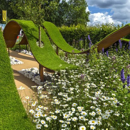 The World Vision Garden, Gold Medal Winning garden at RHS Hampton Court Palace Flower Show, The design of the garden is a horticultural interpretation London.