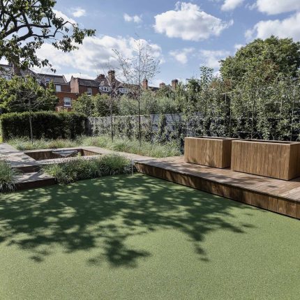 Garden designer contemporary family garden Chiswick friendly space decking, dining table, an aluminum pergola in powder-coated finish, a cozy and warm outlook.