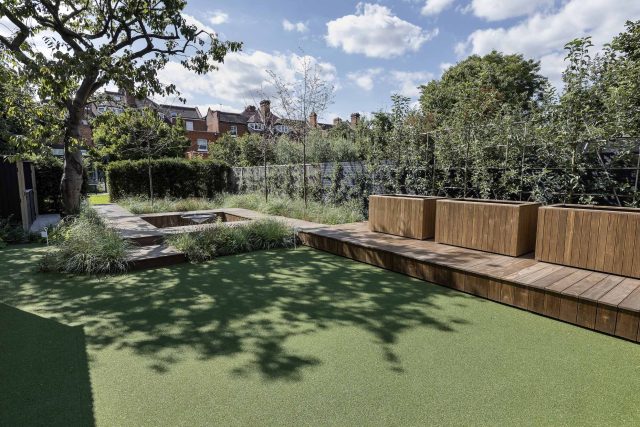 Garden designer contemporary family garden Chiswick friendly space decking, dining table, an aluminum pergola in powder-coated finish, a cozy and warm outlook.
