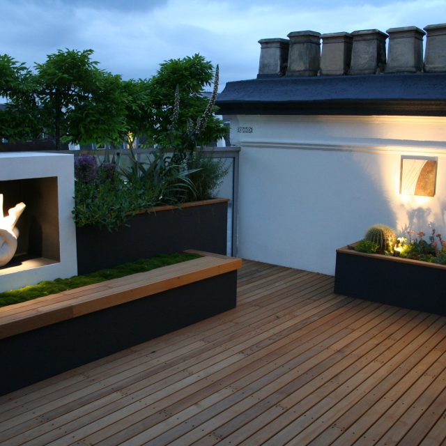 Kensington Roof Garden Terrace roof top designer by Andy Sturgeon combines timber and mixed planting to the highest level creating a beautiful roof top space.