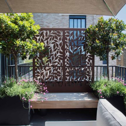 Roof terrace design Covent Garden composite decking luxurious entertaining in the heart of London with contemporary furniture a bio-fuel burning fire table.