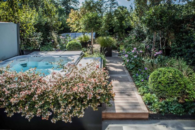 Garden Designer Guildford Surrey Garden Design Landscape Contractor builders, raised decked pathway leads from the gleaming terrace to the hot tub area where an.