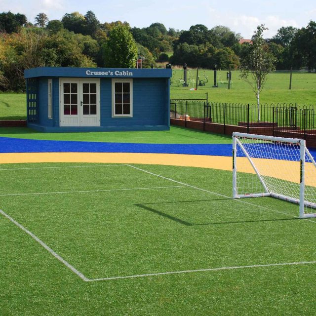 Play Zone designed by Nigel Abbey Design and landscaped by The Garden Builders, running track, play surfaces, football pitch basket ball court play zone design.