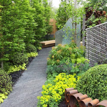 Award winning garden 2013 RHS Silver Gilt Medal at Chelsea Flower Show Garden, The Garden Builders Darren Hawkes Designer, opaque glass screens, steel balls.