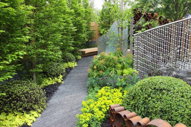 Award winning garden 2013 RHS Silver Gilt Medal at Chelsea Flower Show Garden, The Garden Builders Darren Hawkes Designer, opaque glass screens, steel balls.