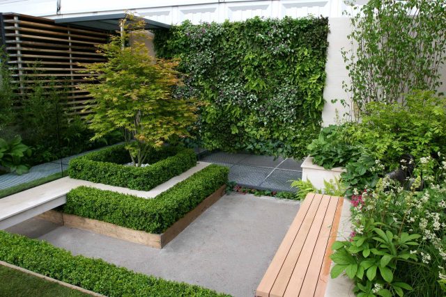 Award Winning Eco Chic Garden RHS Gold Medal 09 designed by Kate Gould constructed by The Garden Builders Chelsea Flower Show 2009 pergola hedging shrubs.