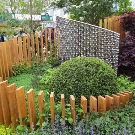 Award winning garden 2013 RHS Silver Gilt Medal at Chelsea Flower Show Garden, The Garden Builders Darren Hawkes Designer, opaque glass screens, steel balls.
