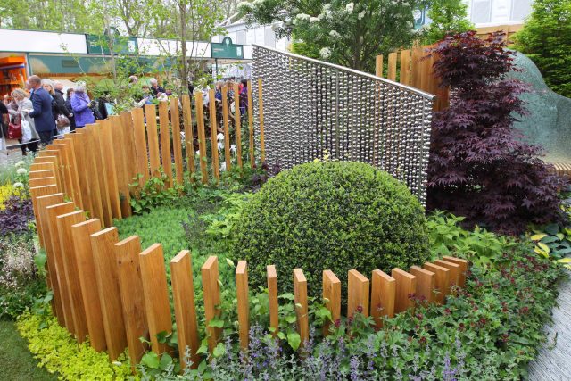 Award winning garden 2013 RHS Silver Gilt Medal at Chelsea Flower Show Garden, The Garden Builders Darren Hawkes Designer, opaque glass screens, steel balls.