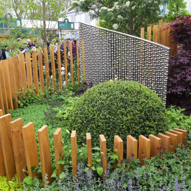 Award winning garden 2013 RHS Silver Gilt Medal at Chelsea Flower Show Garden, The Garden Builders Darren Hawkes Designer, opaque glass screens, steel balls.