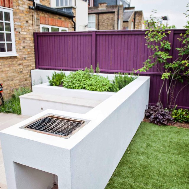 Garden design Wimbledon, family garden designers The Garden Builders Landscape consultants Surrey, raised bed with limestone seating, integrated relaxation.