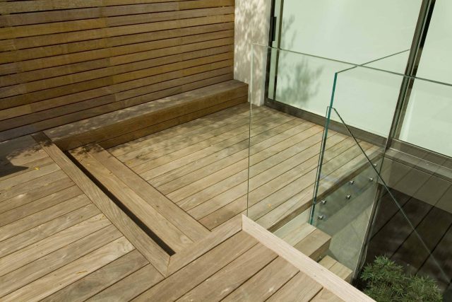 Lane swimming pool and contemporary garden designed and built by The Garden Builders Fulham London SW6, symmetry with the pool strategically planted pockets.