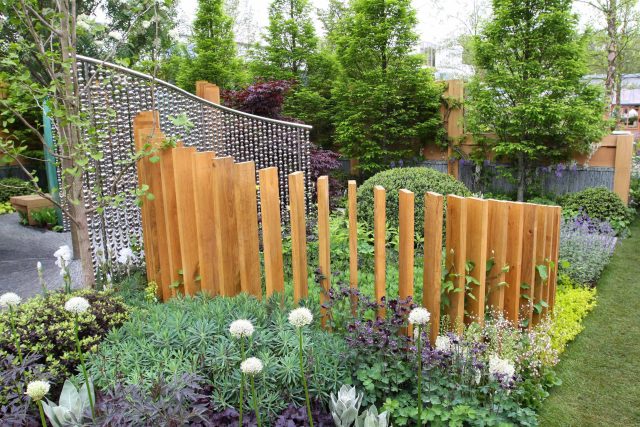 Award winning garden 2013 RHS Silver Gilt Medal at Chelsea Flower Show Garden, The Garden Builders Darren Hawkes Designer, opaque glass screens, steel balls.