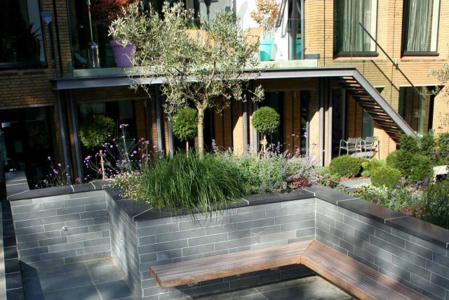 Stunning Family Garden designers Surrey APL Awards 09 Lynne Marcus Garden Design in Kingston Surrey Greater London area, water feature, sculptures, planting.