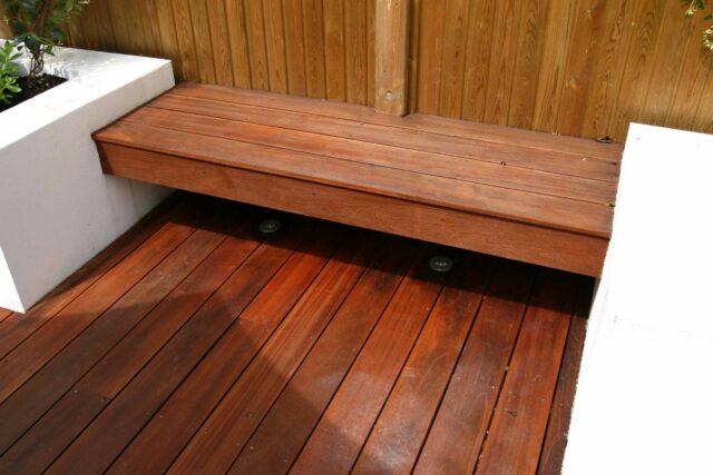 Decking design london elegant walled outdoor entertaining space Wimbledon South West London, lush planting, cozy relaxing outdoor dining area, water feature.
