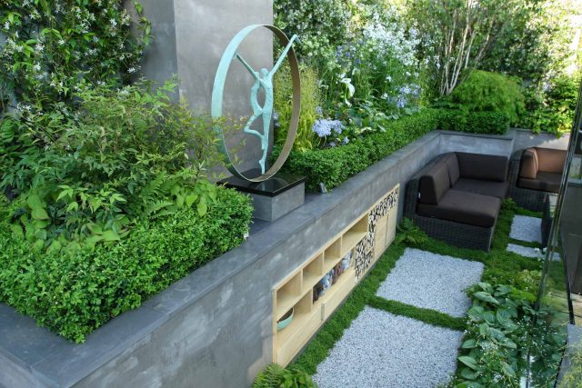 Award Winning RHS Silver Gilt Medal by Kate Gould, The Garden Builders RHS Chelsea Flower Show 2010, outdoor room, bio-gel fireplace, concrete chimney.