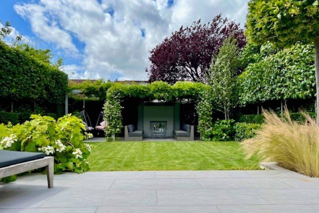 Garden design Wandsworth a medium size garden is divided into three main areas of an urban retreat offering multiple options for relaxation outdoor fireplace.