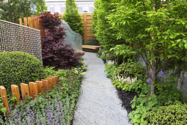 Award winning garden 2013 RHS Silver Gilt Medal at Chelsea Flower Show Garden, The Garden Builders Darren Hawkes Designer, opaque glass screens, steel balls.